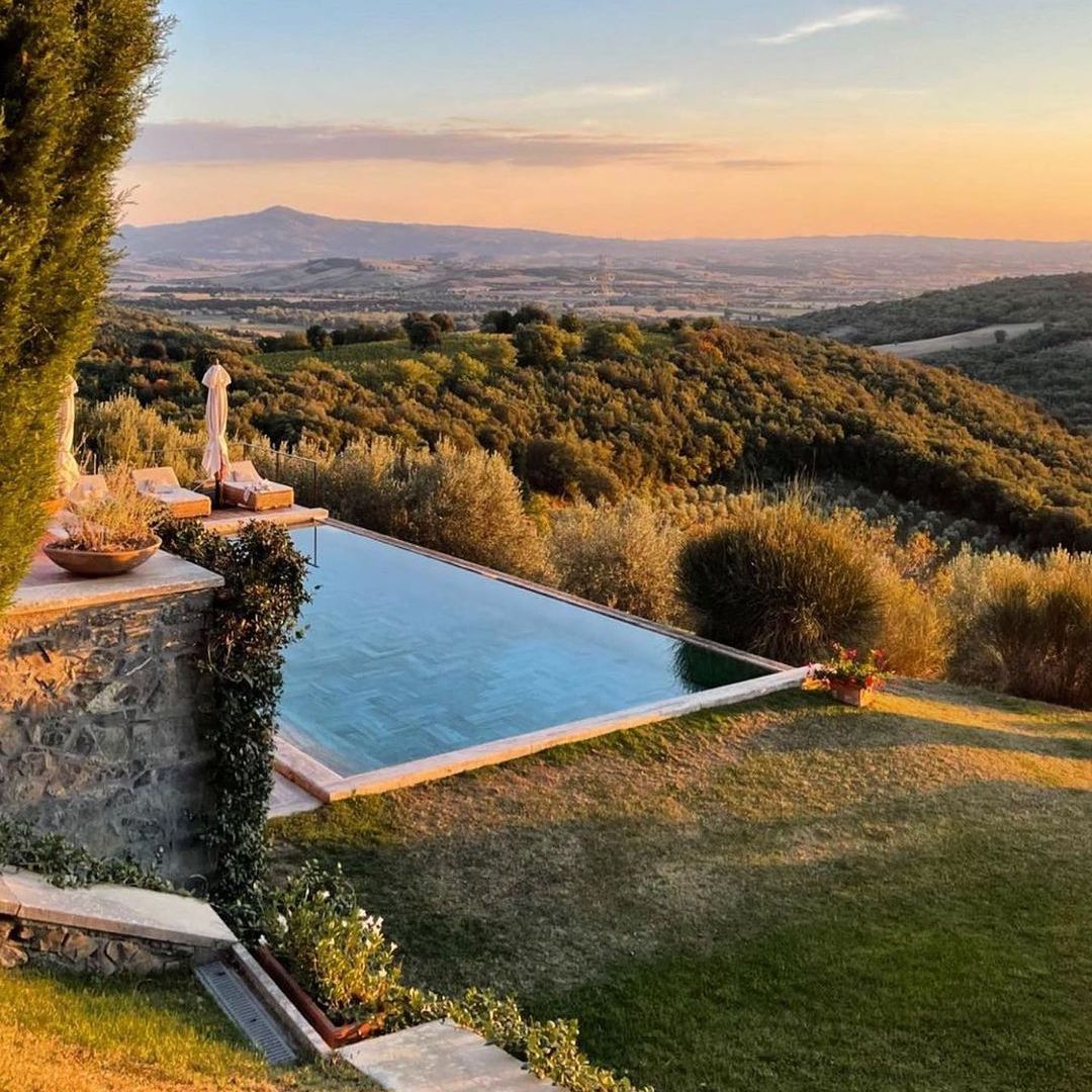 Castello di Vicarello - view of pool and Tuscan in background.