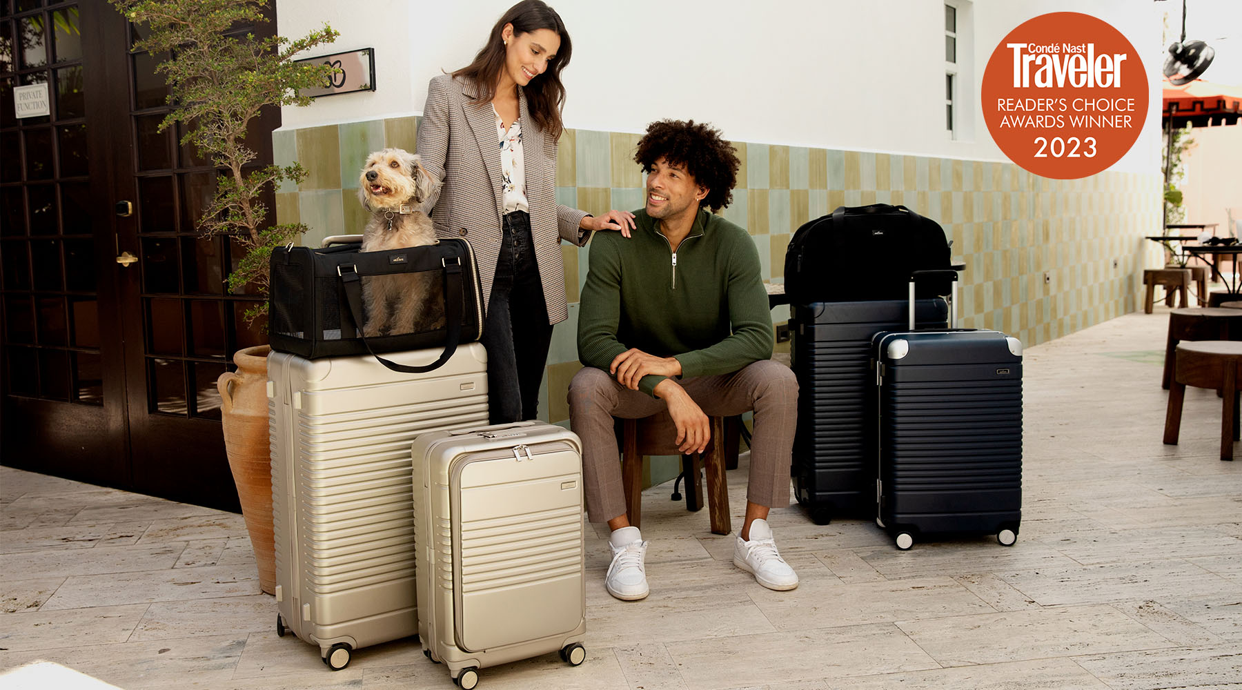 man and woman with luggage surrounding them
