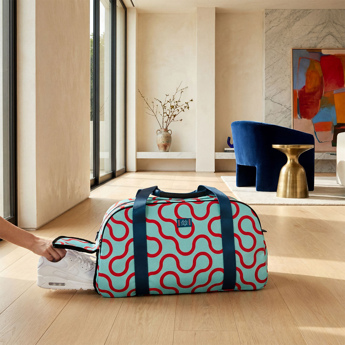 weekender with white shoes going in