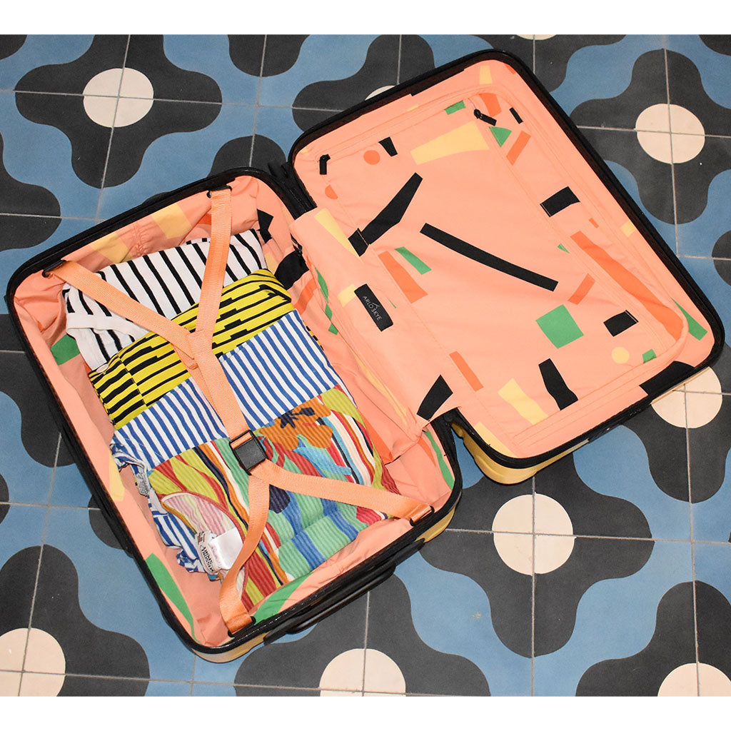 dusen dusen lemon carry-on open with limited edition print visible.