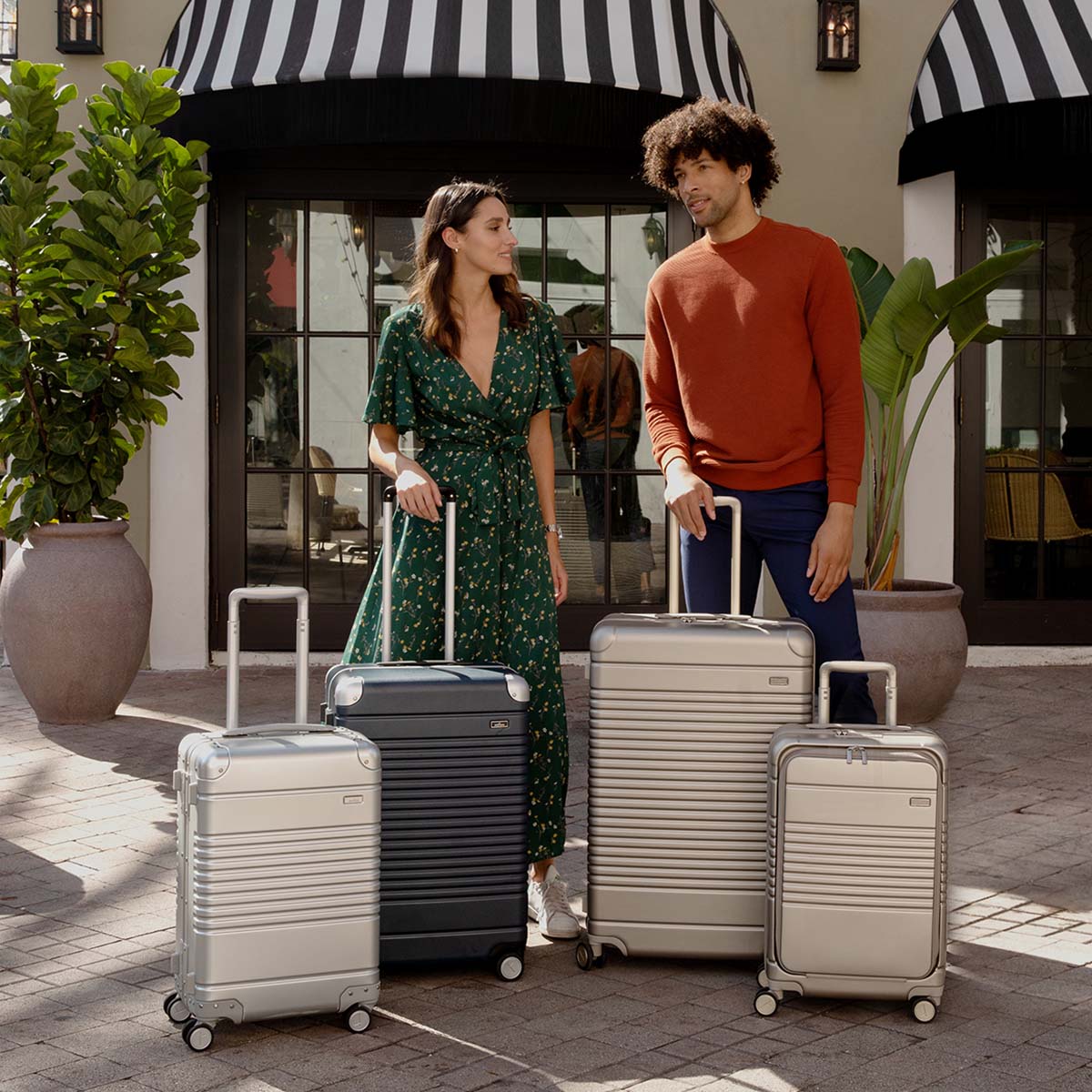 man and woman with luggage - 4 pieces total.