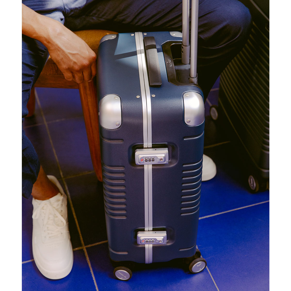 navy carry-on showing two clasp locks