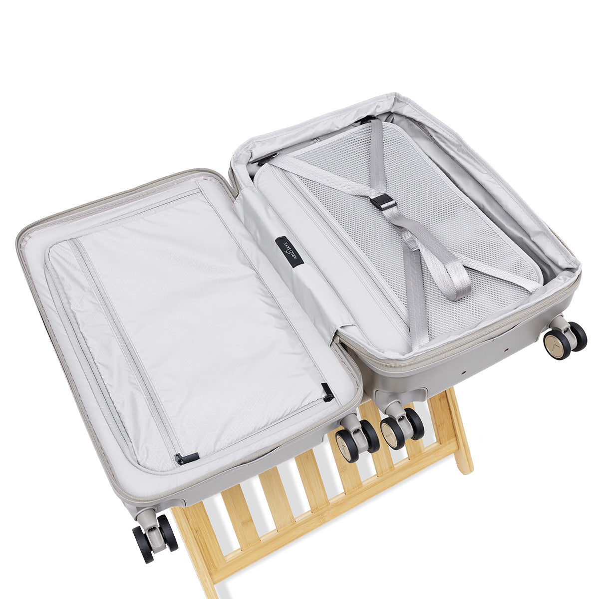 champagne carry-on max with front pocket expandable flat lay open view of both sides of the interior and compression system with removable divider panel
