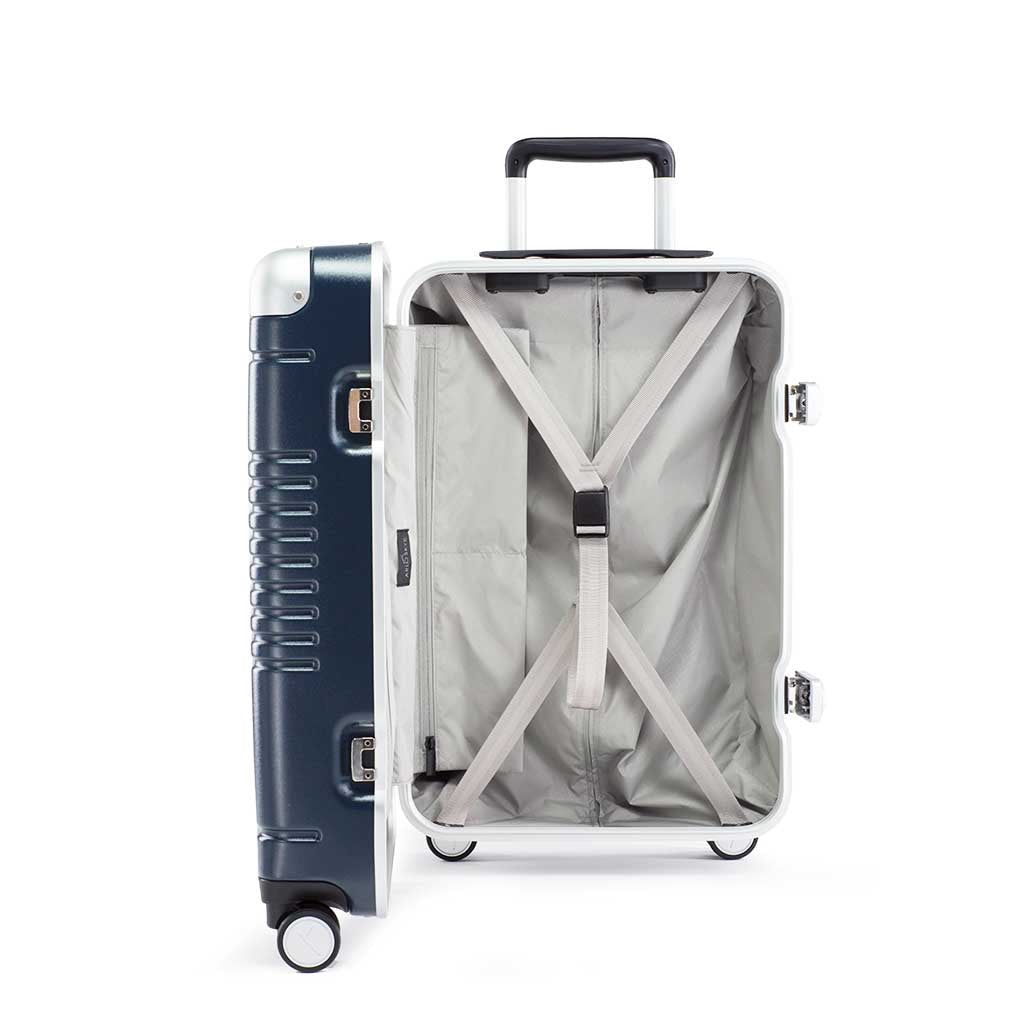 Side view of the frame carry-on max in navy blue showing the interior of the left shell