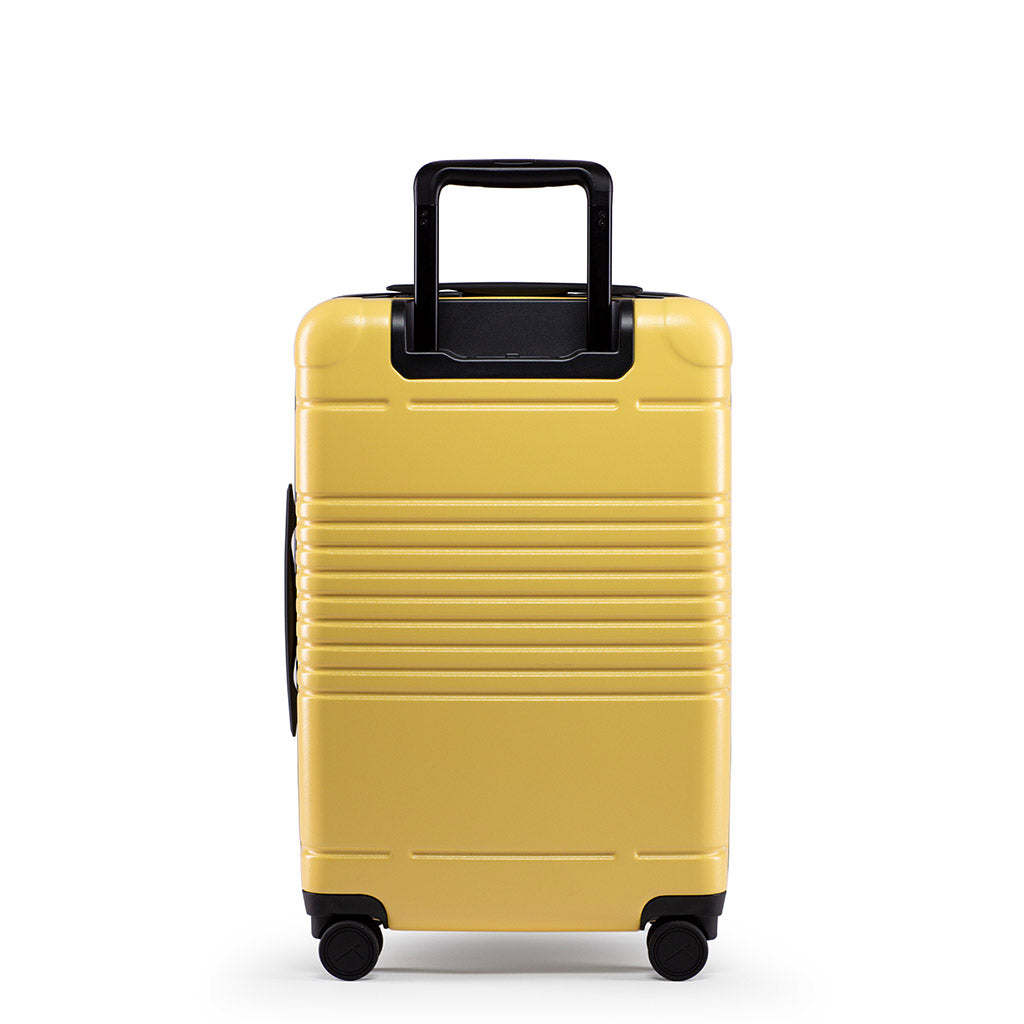 Back view of the zipper carry-on max in yellow