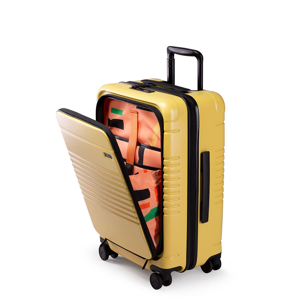 Left facing view of the zipper carry-on max with front pocket in yellow