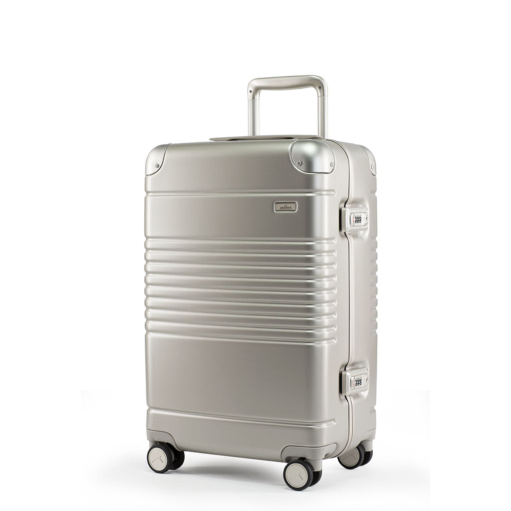 Left facing view of the Frame carry-on max in champagne.