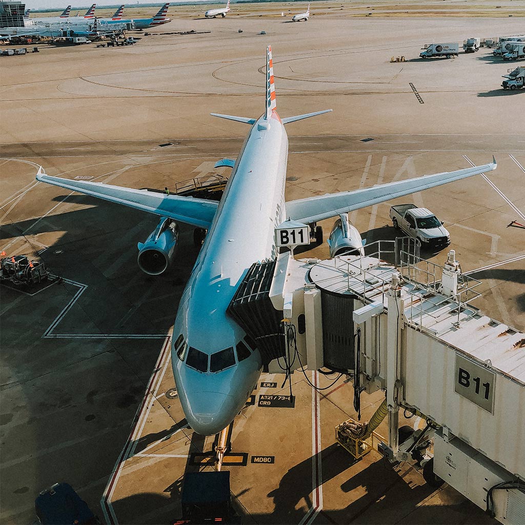 An American Airlines plan visible in full from the boarding area glass window.