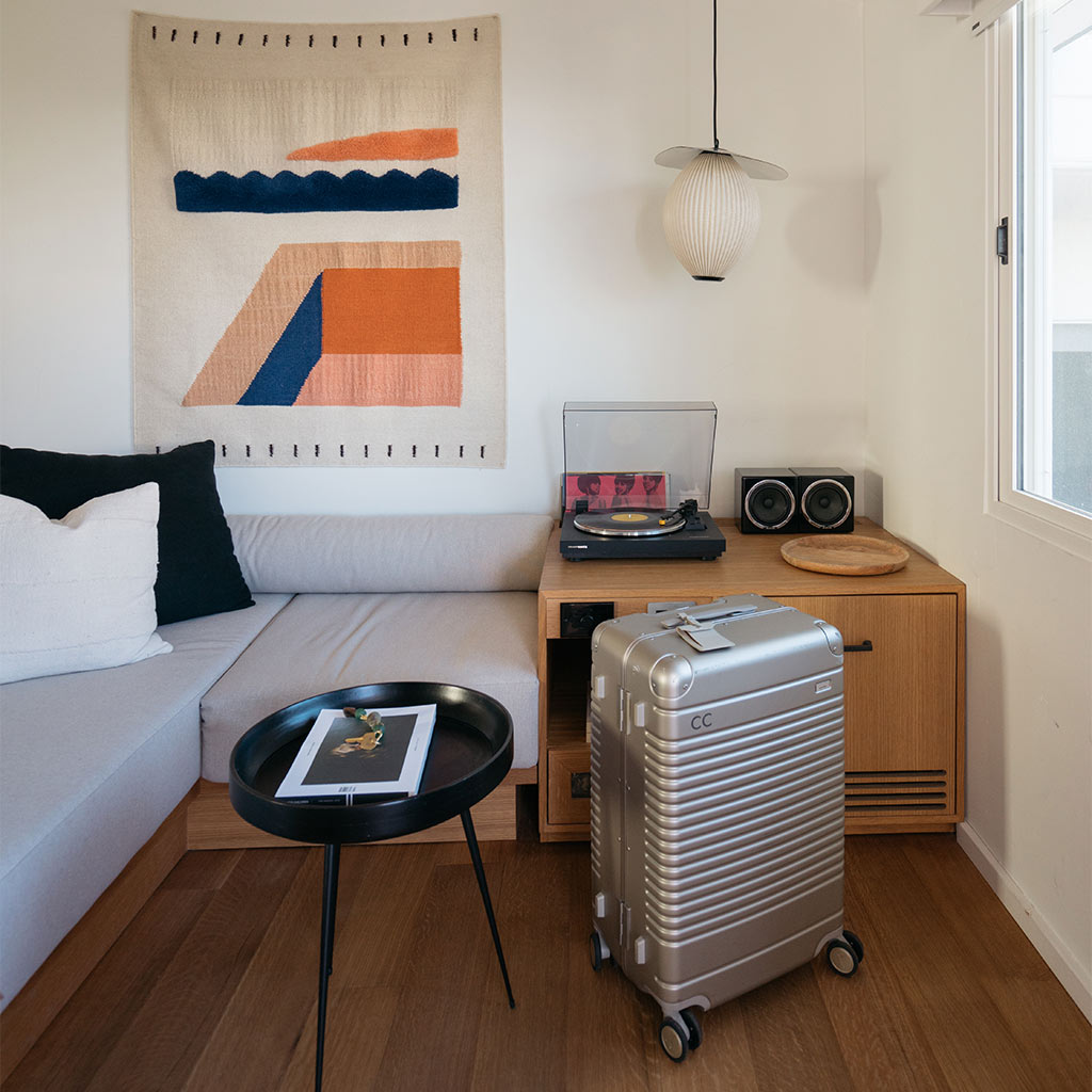 A room at Hotel Joaquin in California with an Arlo Skye Check-In case in Champagne color.