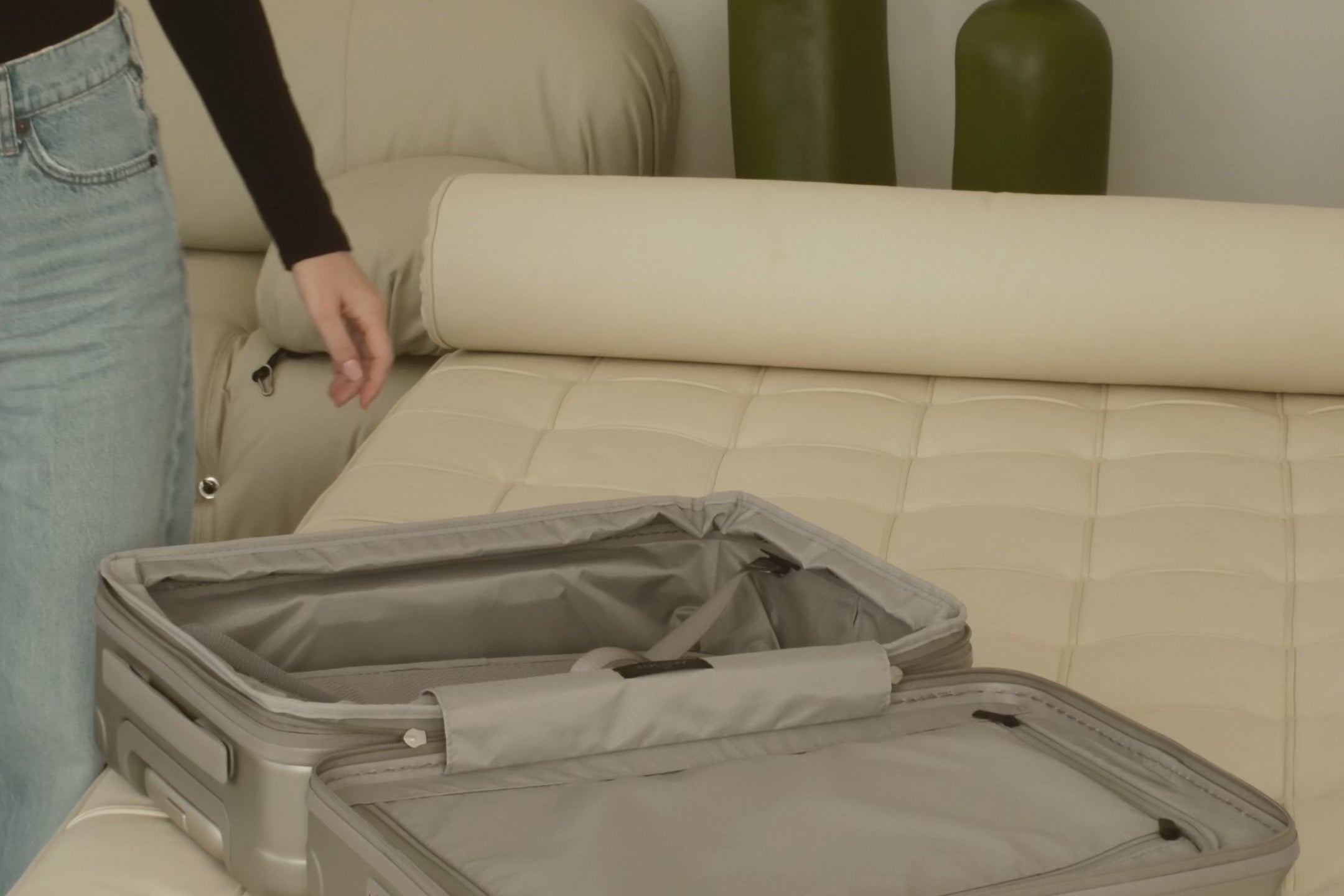 champagne carry-on max with front pocket flat lay view on how to unzip the expandable zipper