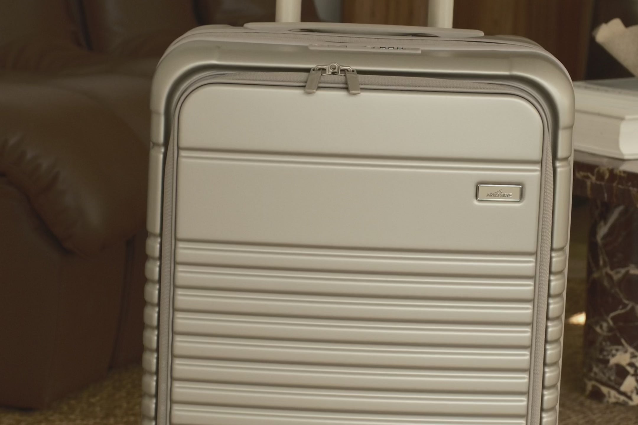 champagne carry-on max with front pocket video on how to open the lock