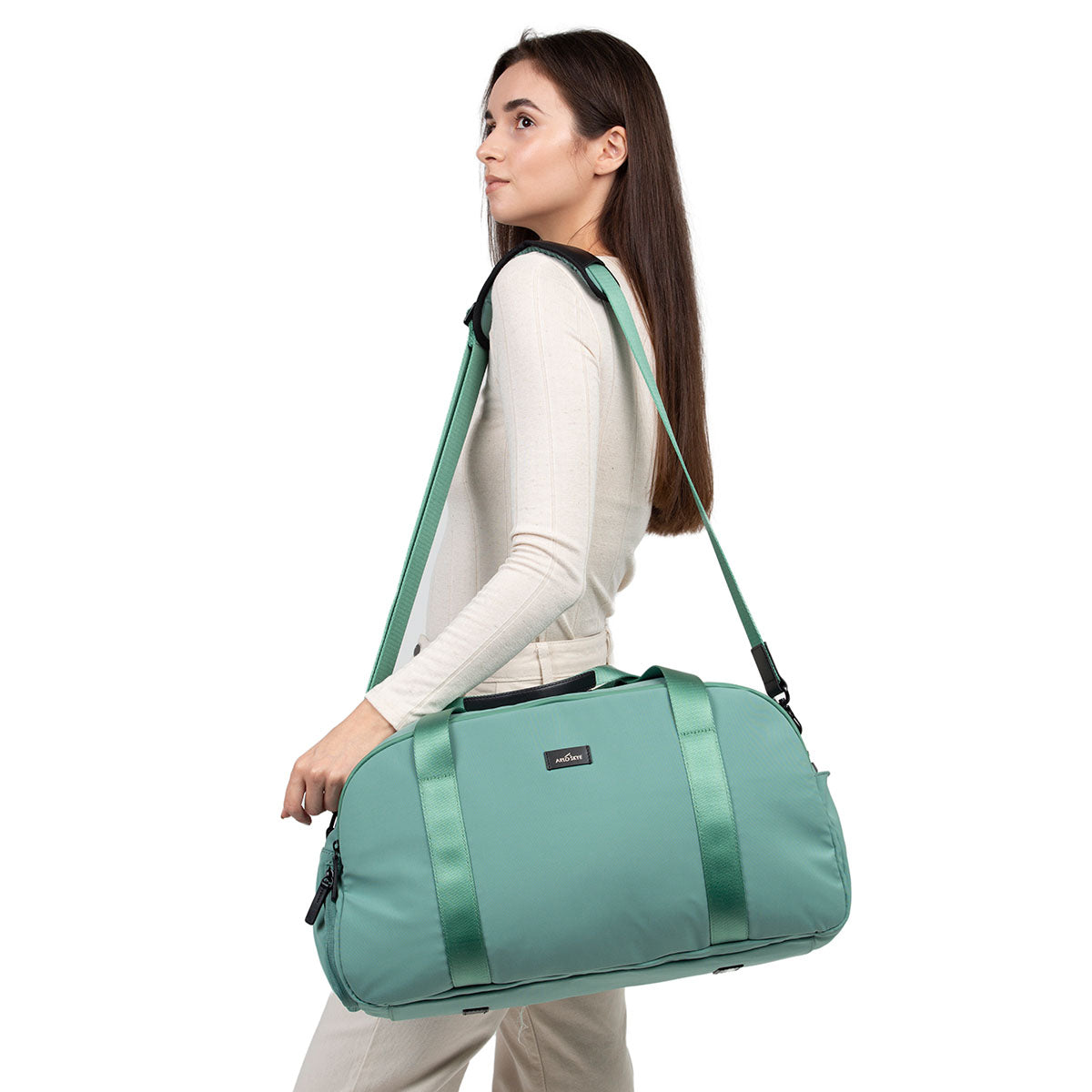woman with mint weekender with shoulder strap