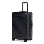 Left facing view of the expandable check-in medium in black