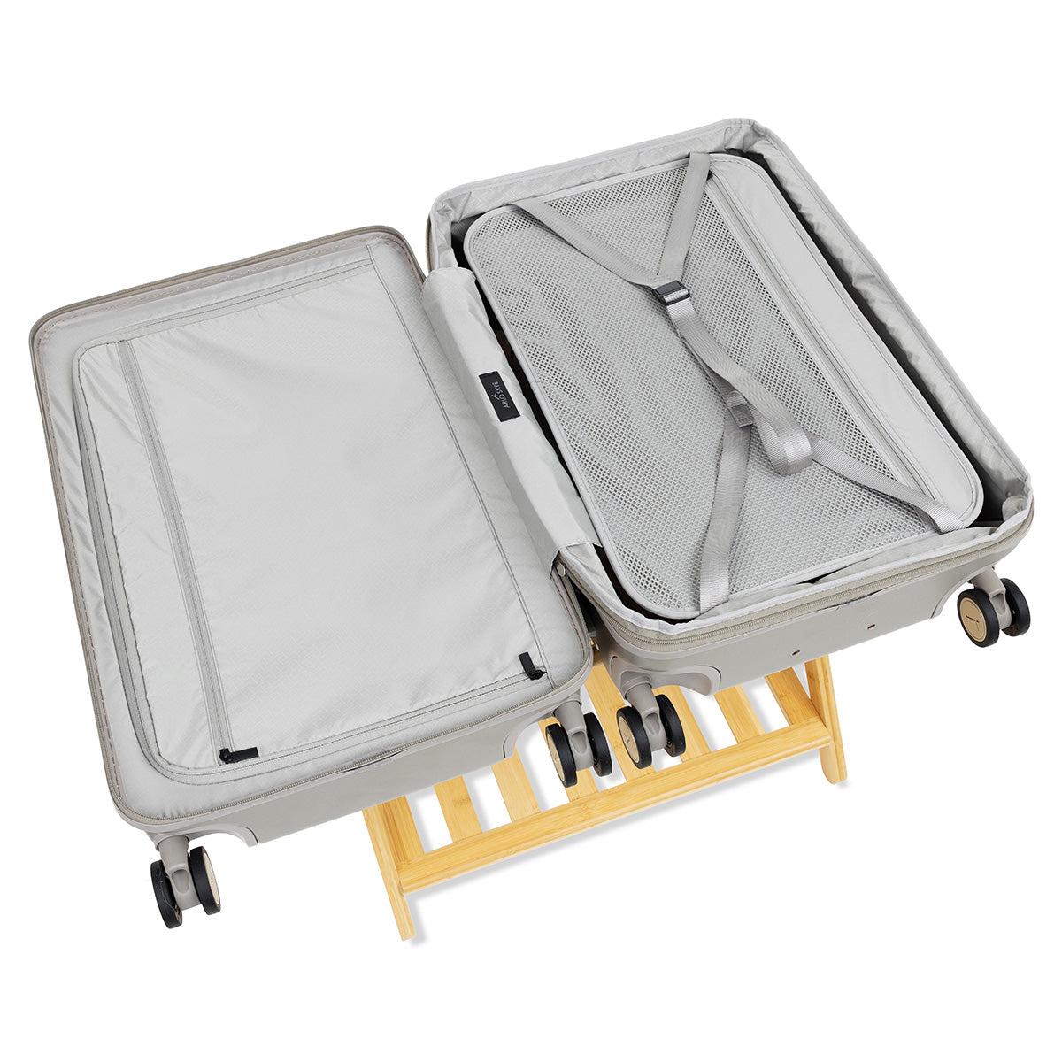 Open expandable check-in medium in champagne showing both sides of the interior with divider panel