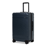 Left facing view of the expandable check-in medium in navy