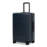 Left facing view of the expandable check-in medium in navy