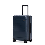 Left facing view of the expandable carry-on max in navy