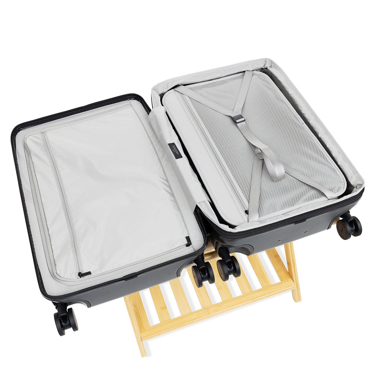 Open expandable check-in medium in black showing both sides of the interior with divider panel