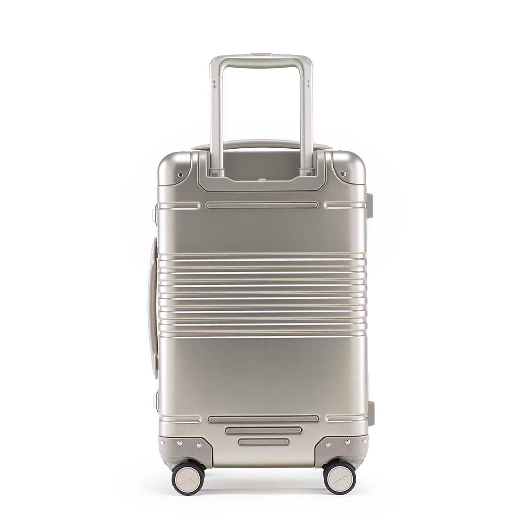 Back view of the frame carry-on in champagne aluminum edition
