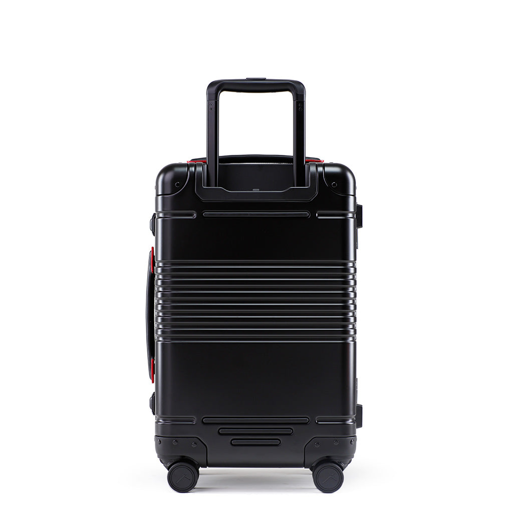 Back view of the frame carry-on in black with red details aluminum edition