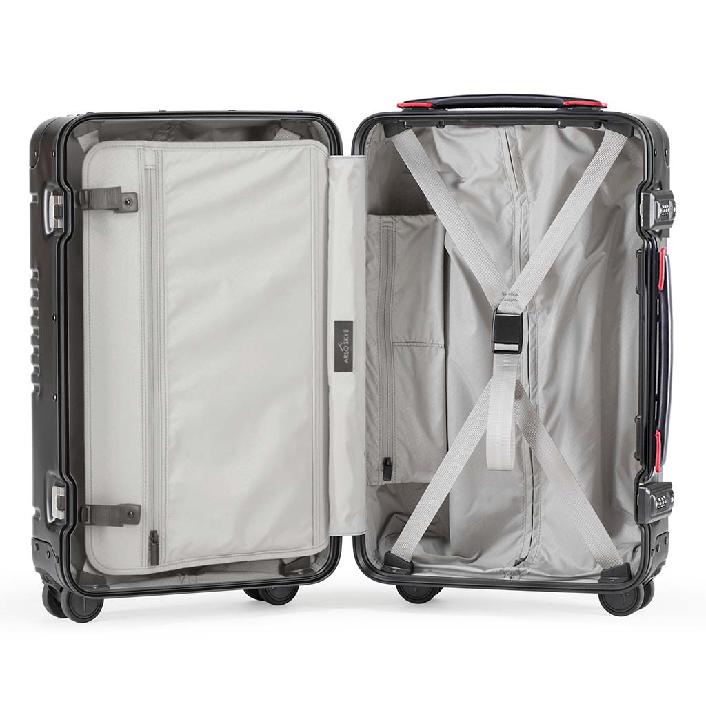 Open frame carry-on in black aluminum edition showing the interior of both sides