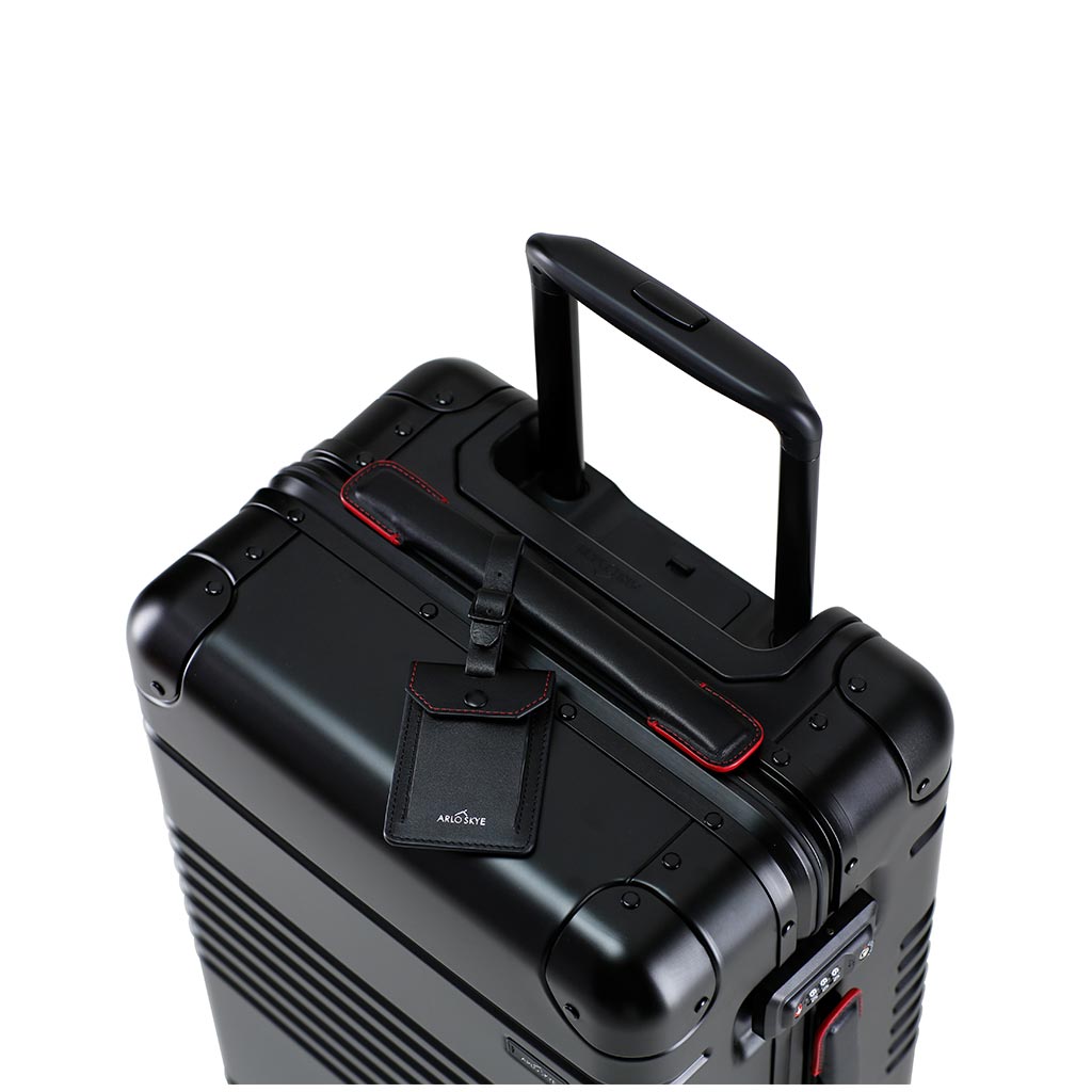 Top down view of the frame carry-on in black with red details aluminum edition