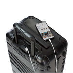 Top down view of frame carry-on max in black showing the spare charger in use