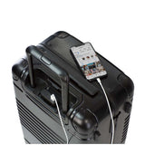 Top down view of frame carry-on max in black showing the spare charger in use
