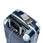 Top down view of frame carry-on max in navy blue showing the spare charger in use