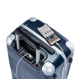 Top down view of frame carry-on max in navy blue showing the spare charger in use