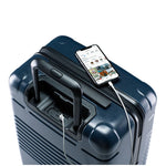 Top view of the zipper carry-on max in navy blue with spare charger in use