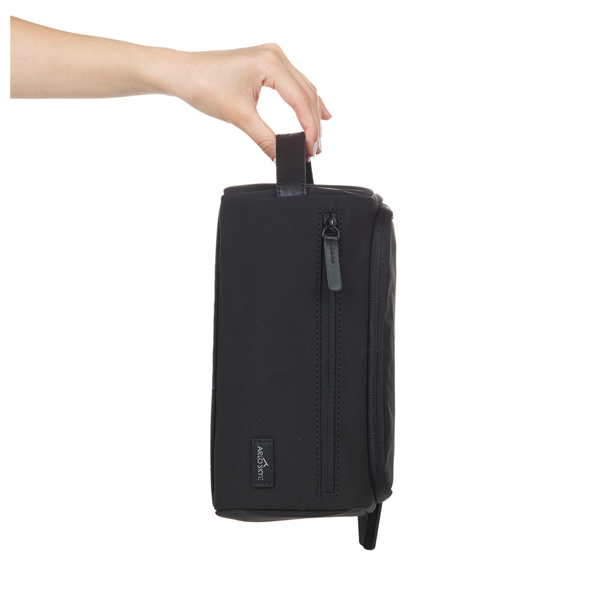 toiletry bag in black color showing exterior view in vertical orientation.