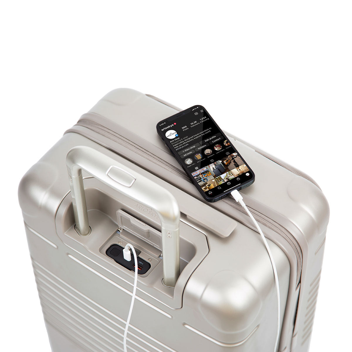zipper carry-on max with front pocket in champagne color - phone charging top view