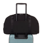 weekender in black - back view on carry-on