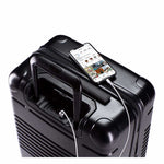 Top view of the zipper carry-on max in black with spare charger in use